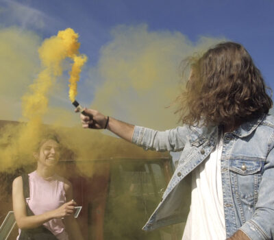 Playing with a yellow smoke bomb